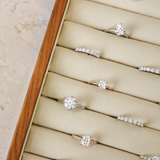 Set of diamond rings in a wooden box on a marble surface
